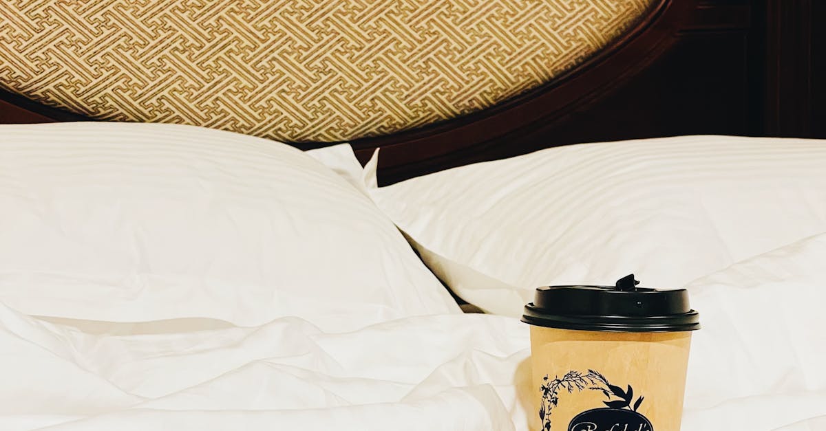 Brown Paper Cup with Lid on the Bed · Free Stock Photo
