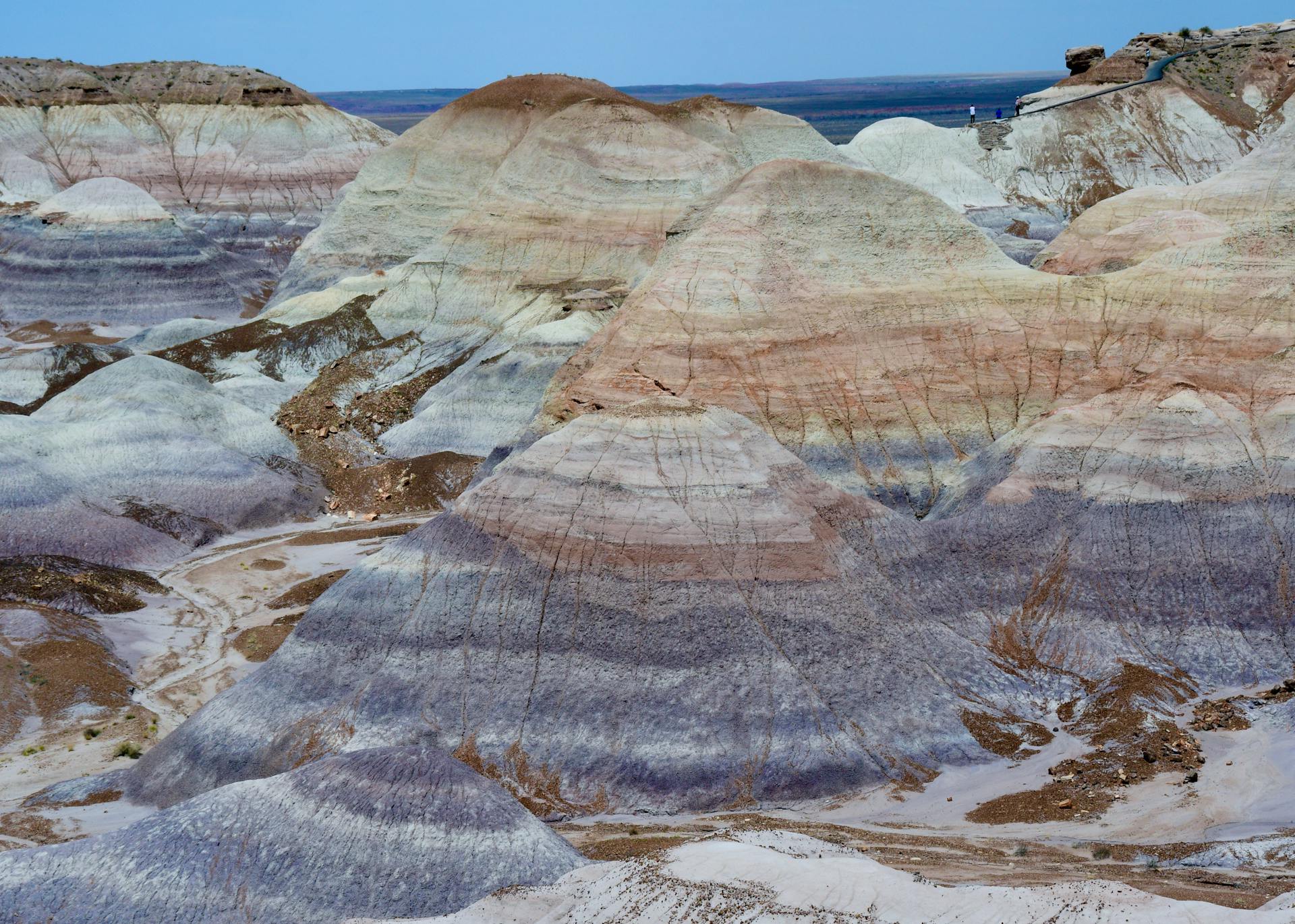 Stunning aerial view showcasing colorful geological rock formations in Arizona's Petrified Forest.