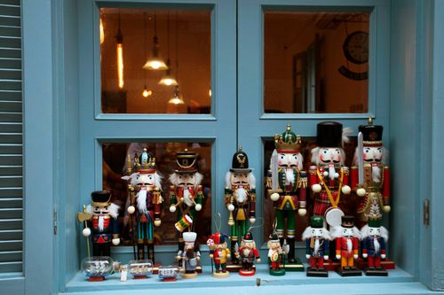 Free A vibrant collection of nutcracker dolls displayed on a window sill in Xiamen, China. Stock Photo