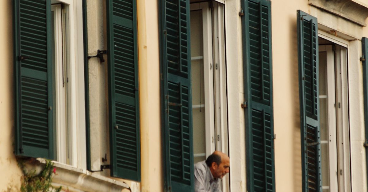 Man Learning Out Window A Man Leaning out of Window · Free Stock Photo