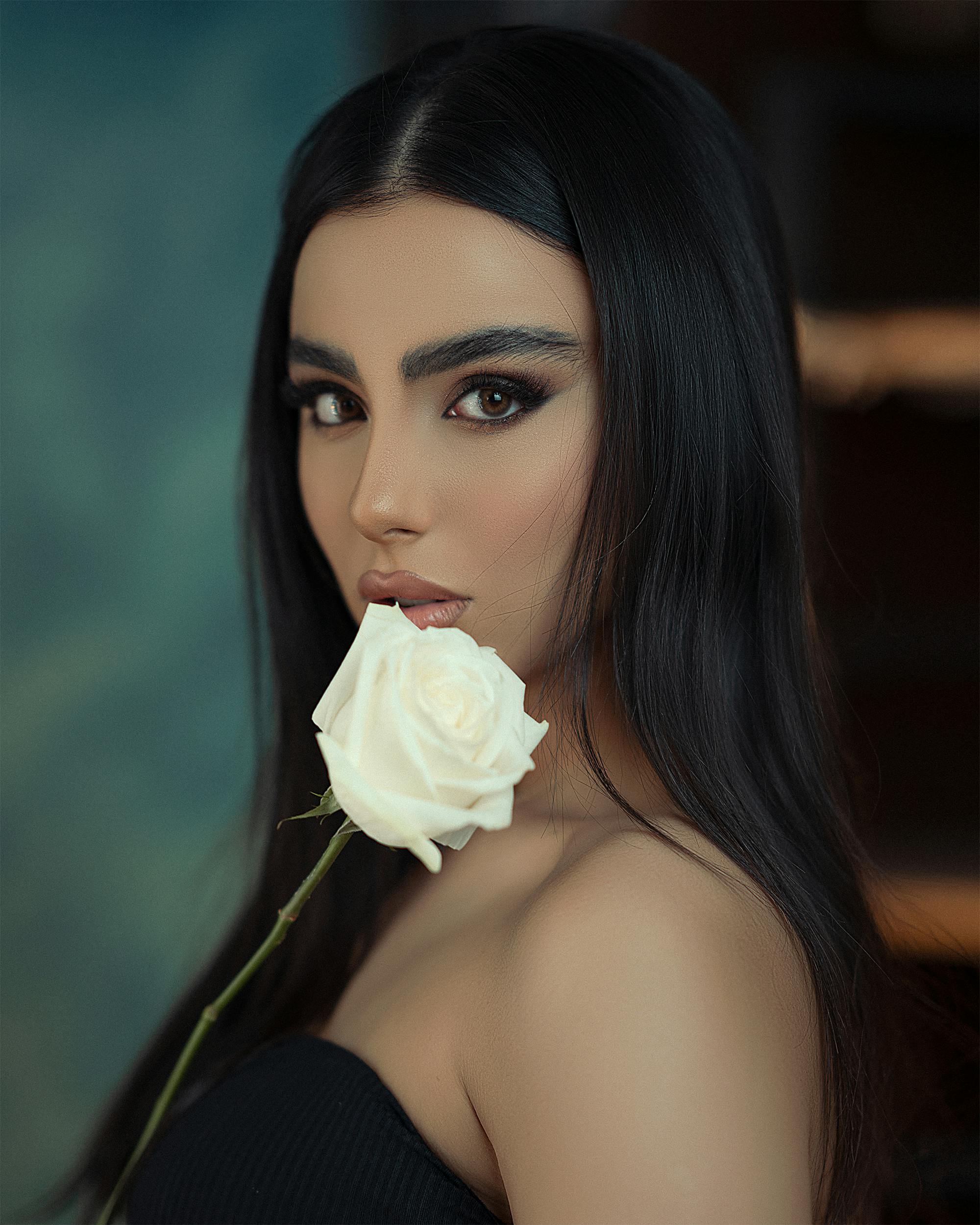 Beautiful Brunette Woman Holding A White Rose · Free Stock Photo