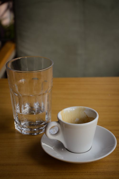 Free Glass and a Cup of Coffee Stock Photo