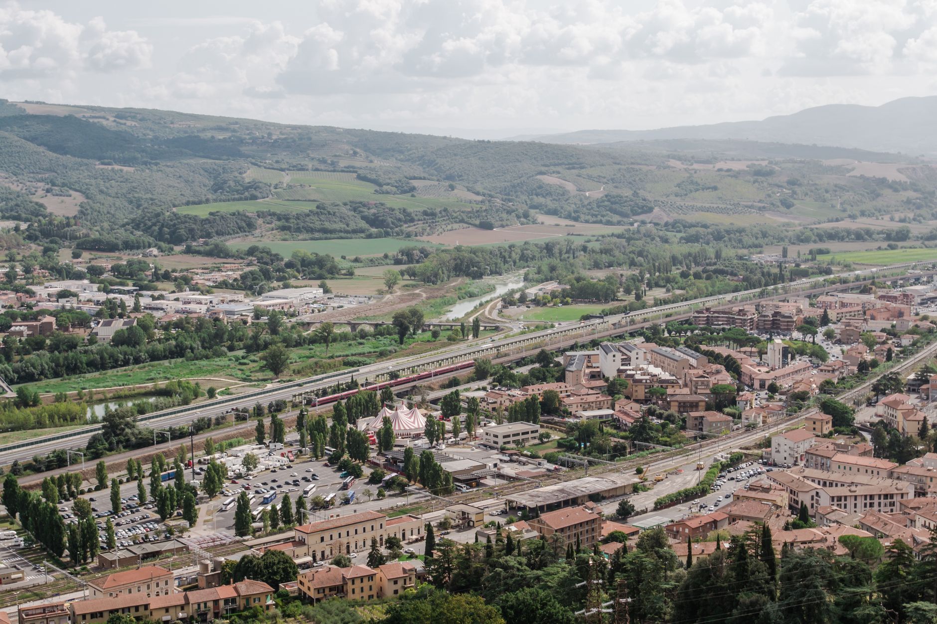 Orvieto on its rock above green Umbrian countryside, one of the easiest day trips from Rome by train
