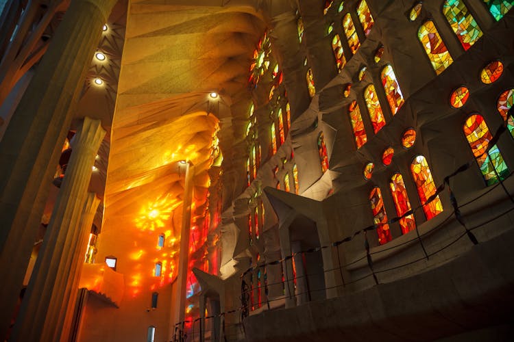 Sunlight Through Stained Glass At Sagrada Familia In Barcelona, Spain