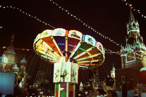 Free Illuminated carousel at Red Square, Moscow at night, featuring vibrant Christmas decorations. Stock Photo