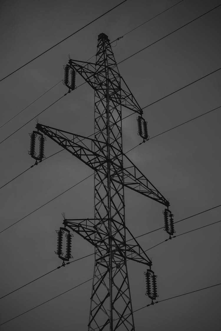 Electric Transmission Tower  Under Gray Sky