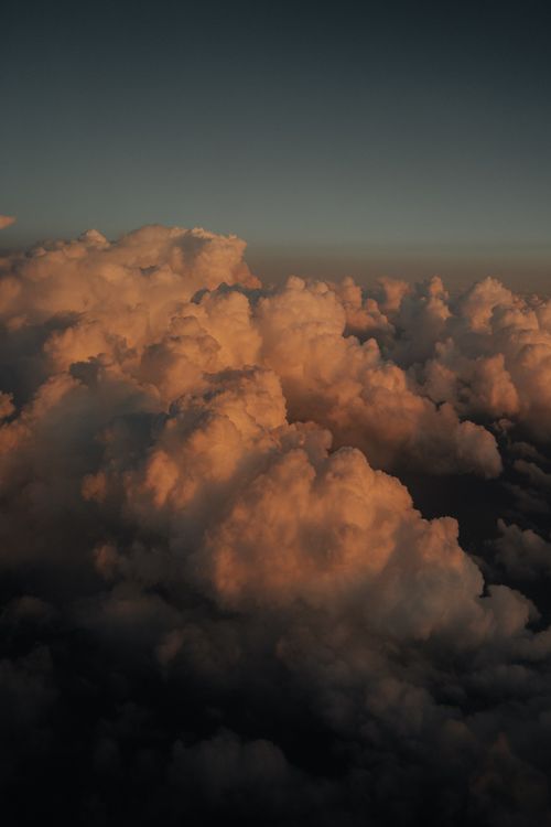 Free Capture of fluffy clouds during a golden hour sunset over Turkey, depicting calm and mesmerizing skies. Stock Photo