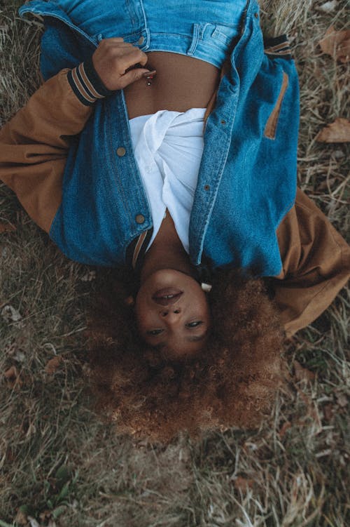 Overhead Shot of a Woman Lying on the Grass