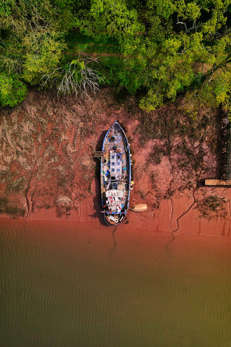 Abandoned Ship Parked On Seashore 