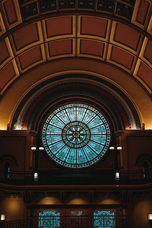Free Intricate stained glass window in an ornate dome ceiling, showcasing elaborate architecture. Stock Photo
