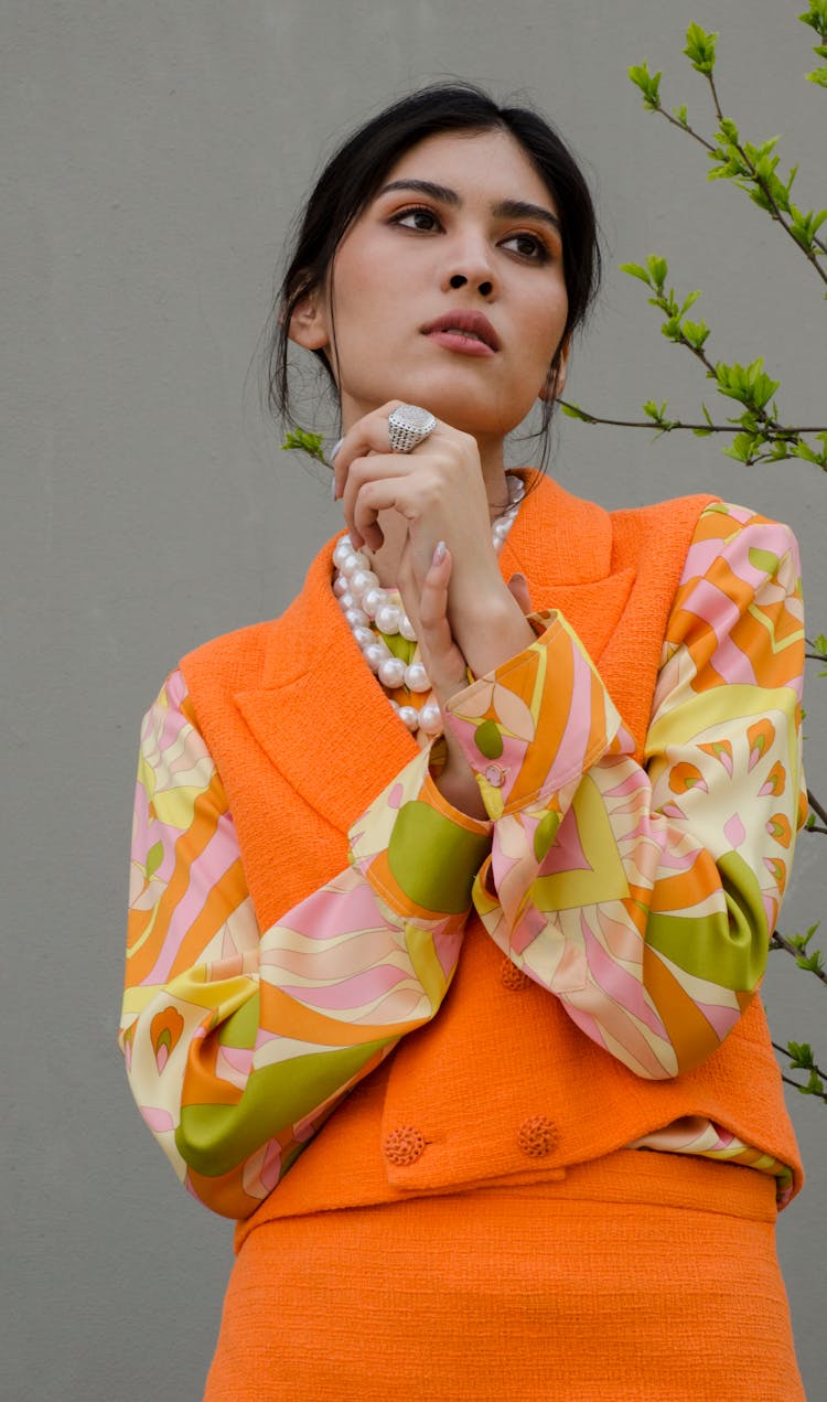 Beautiful Woman In Orange Fashion Clothes