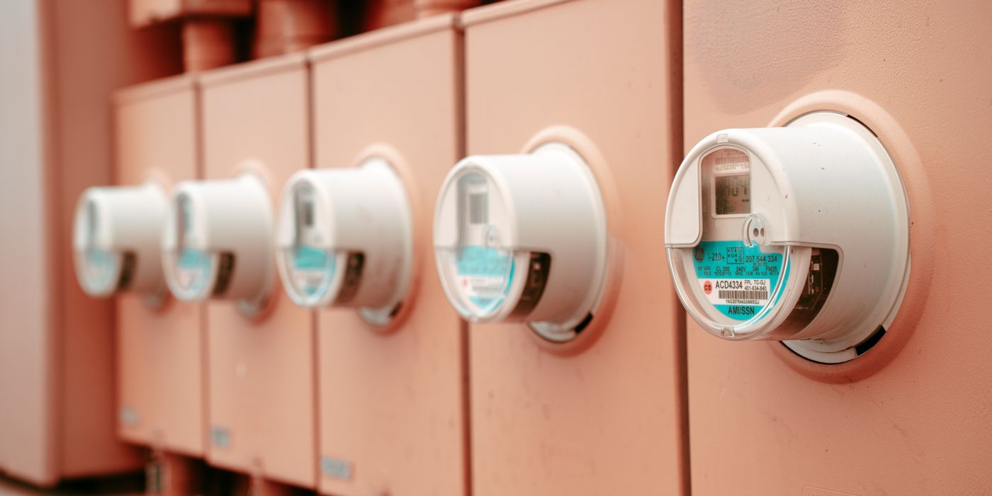 Close-up view of a row of industrial electricity meters for power monitoring and technology.