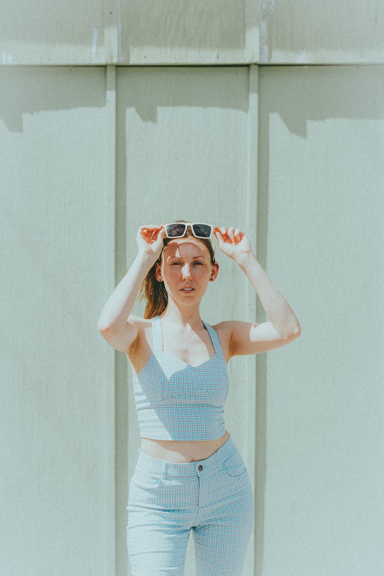 Beautiful Woman Wearing Checkered Clothes And White Sunglasses