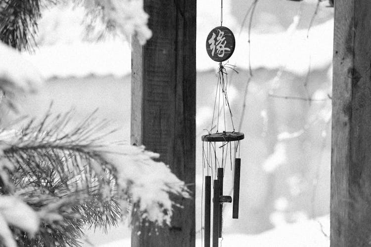 Grayscale Photo Of A Hanging Wind Chime