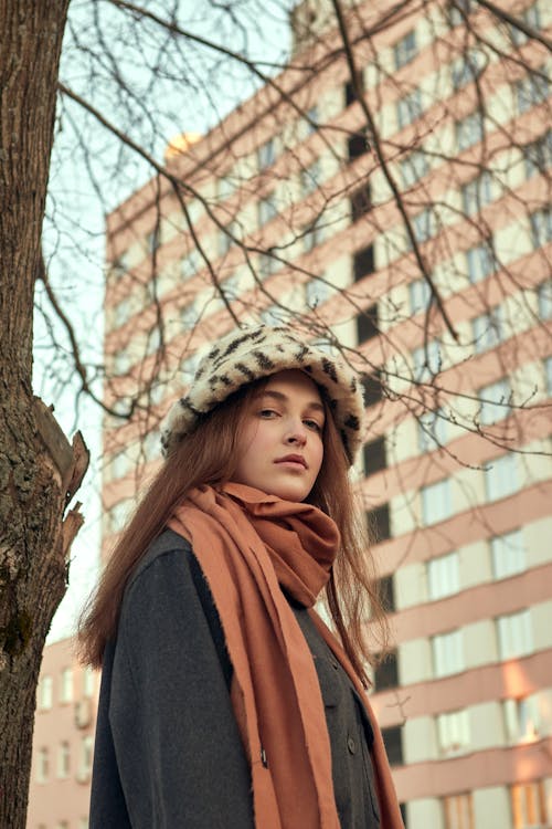 Free Woman in Scarf by Tree in City Stock Photo
