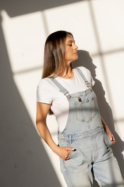 Free Woman in White Shirt and Denim Jumpers Stock Photo
