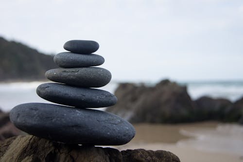 Photo of Stacked Rocks Near Shore