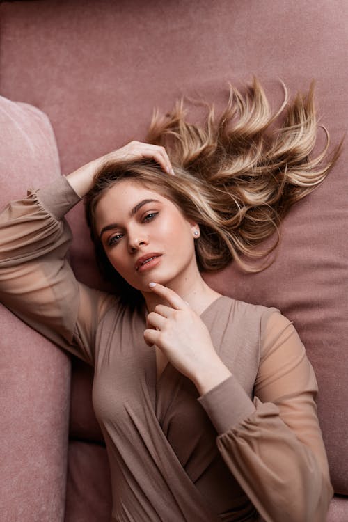 Woman Lying on a Sofa Posing 
