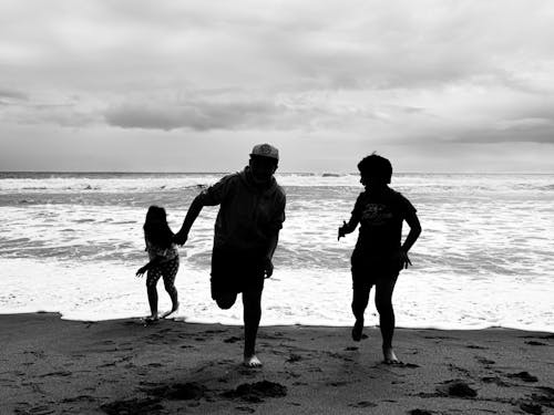Black and White Photo of Kids Playing in the Beach