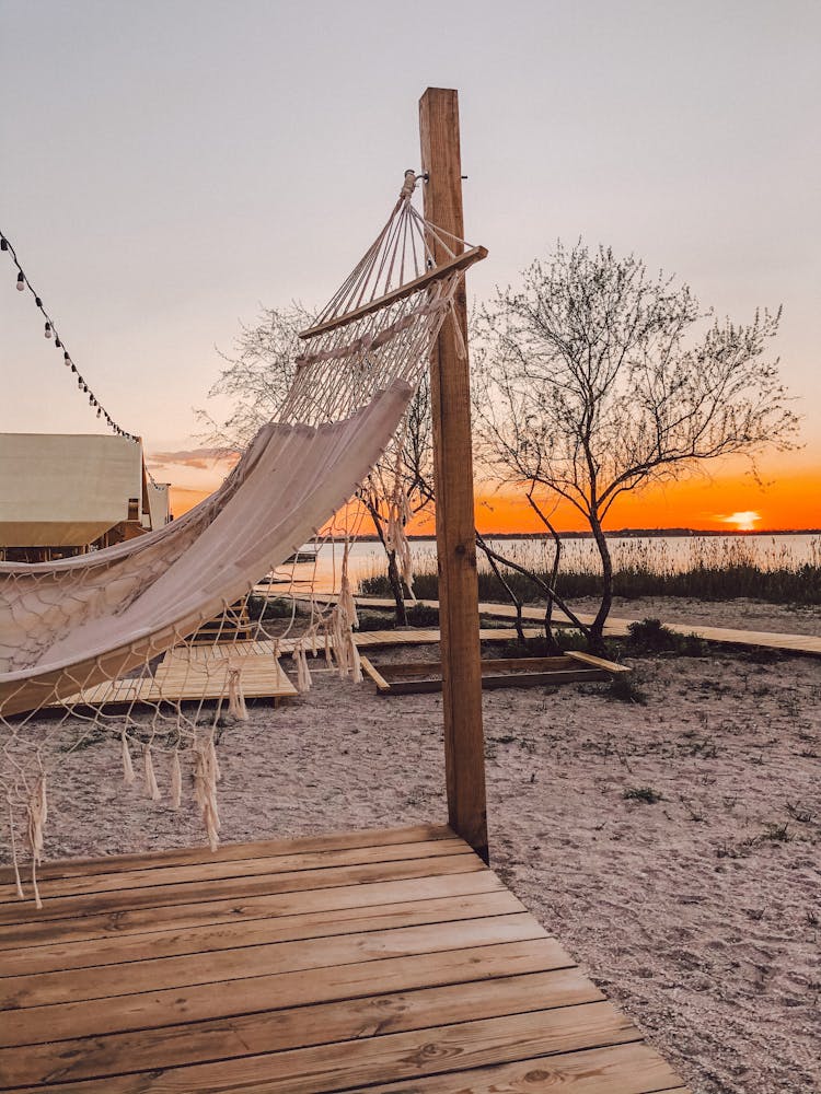 Hammock On Sand Beach On Sunset