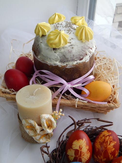 Yellow Meringue on a Cake in a Basket With Eggs
