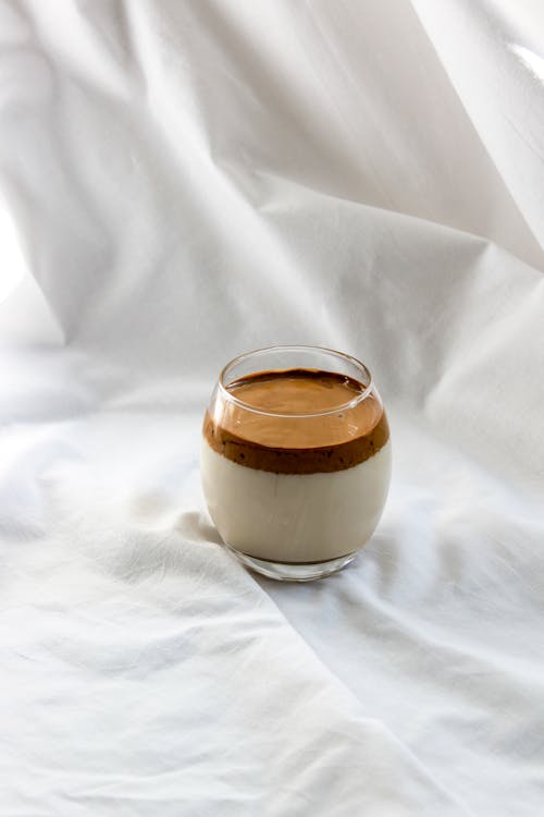 Free Coffee Dessert in Glass on White Bedding Stock Photo