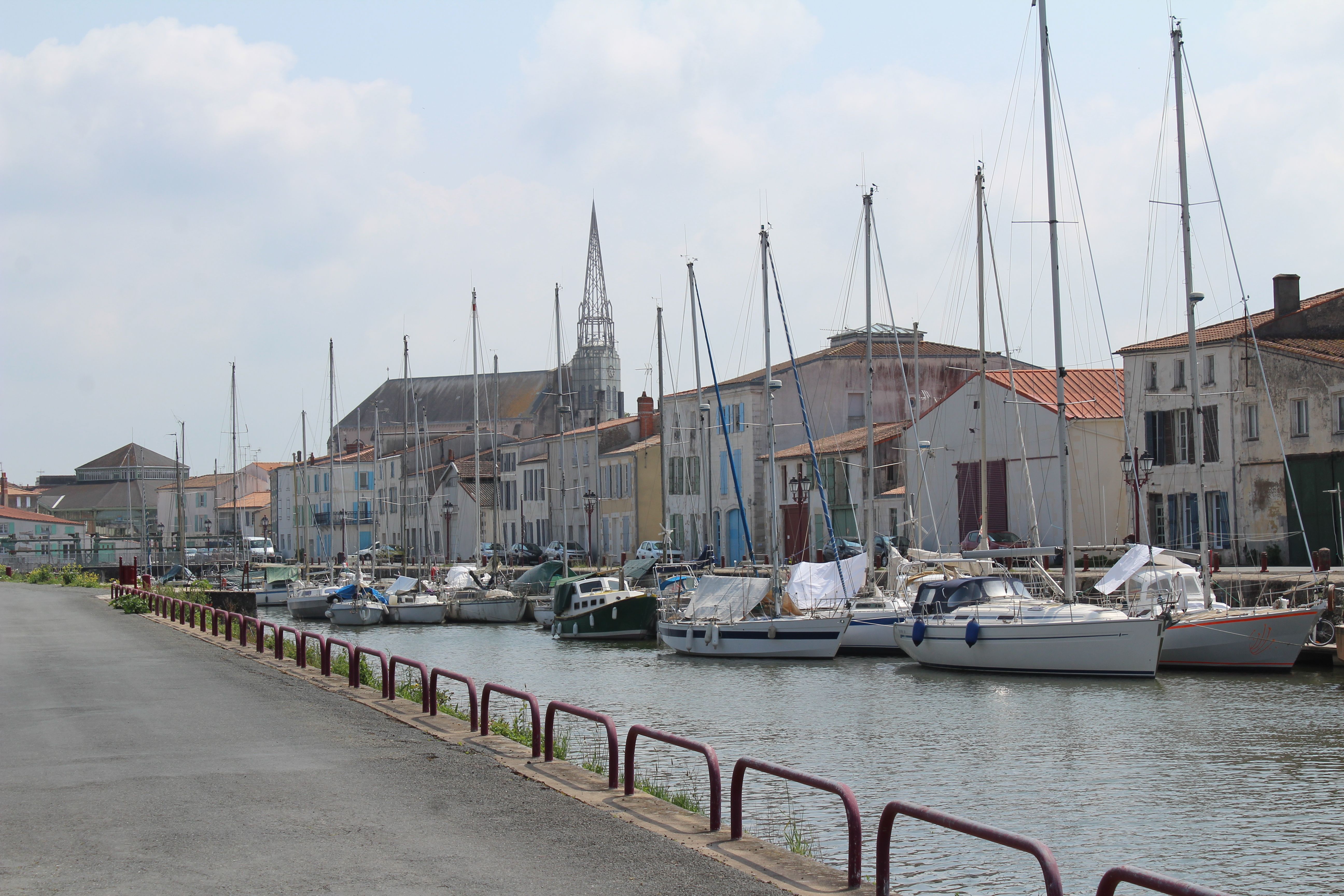 Picturesque view of boats docked along the canal in Marans, Nouvelle-Aquitaine.