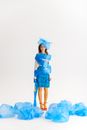 Woman Wrapped in Blue Garbage Bags