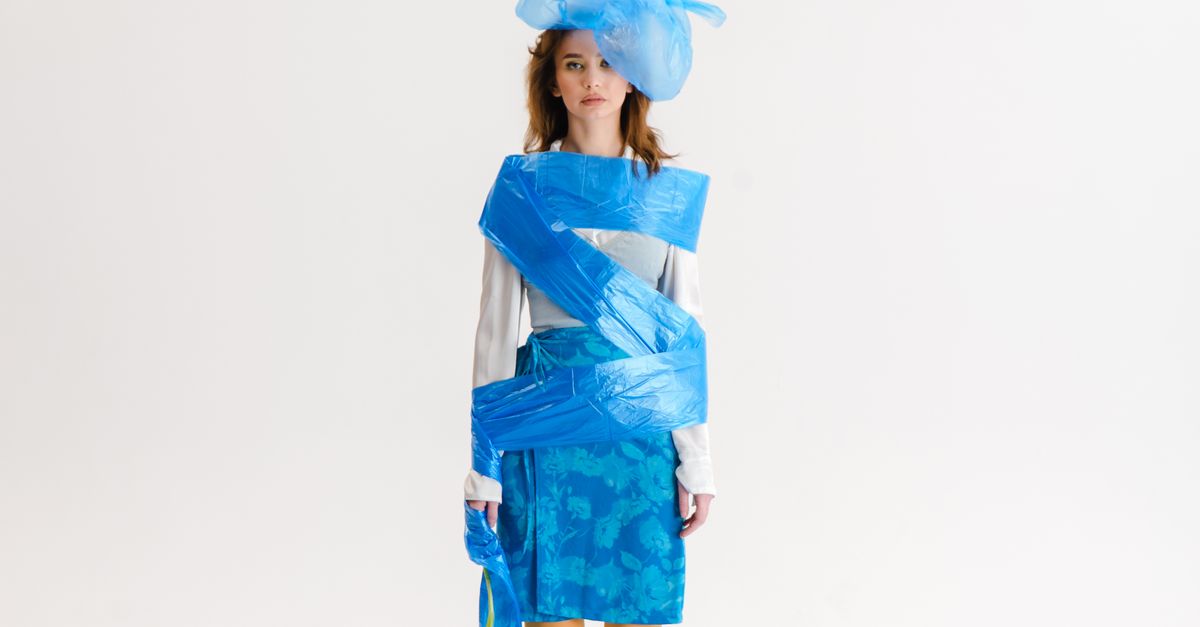 Body Wrapped Garbage Woman Wrapped in Blue Garbage Bags · Free Stock Photo