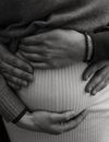 Grayscale Photo of Man and Woman Holding Hands