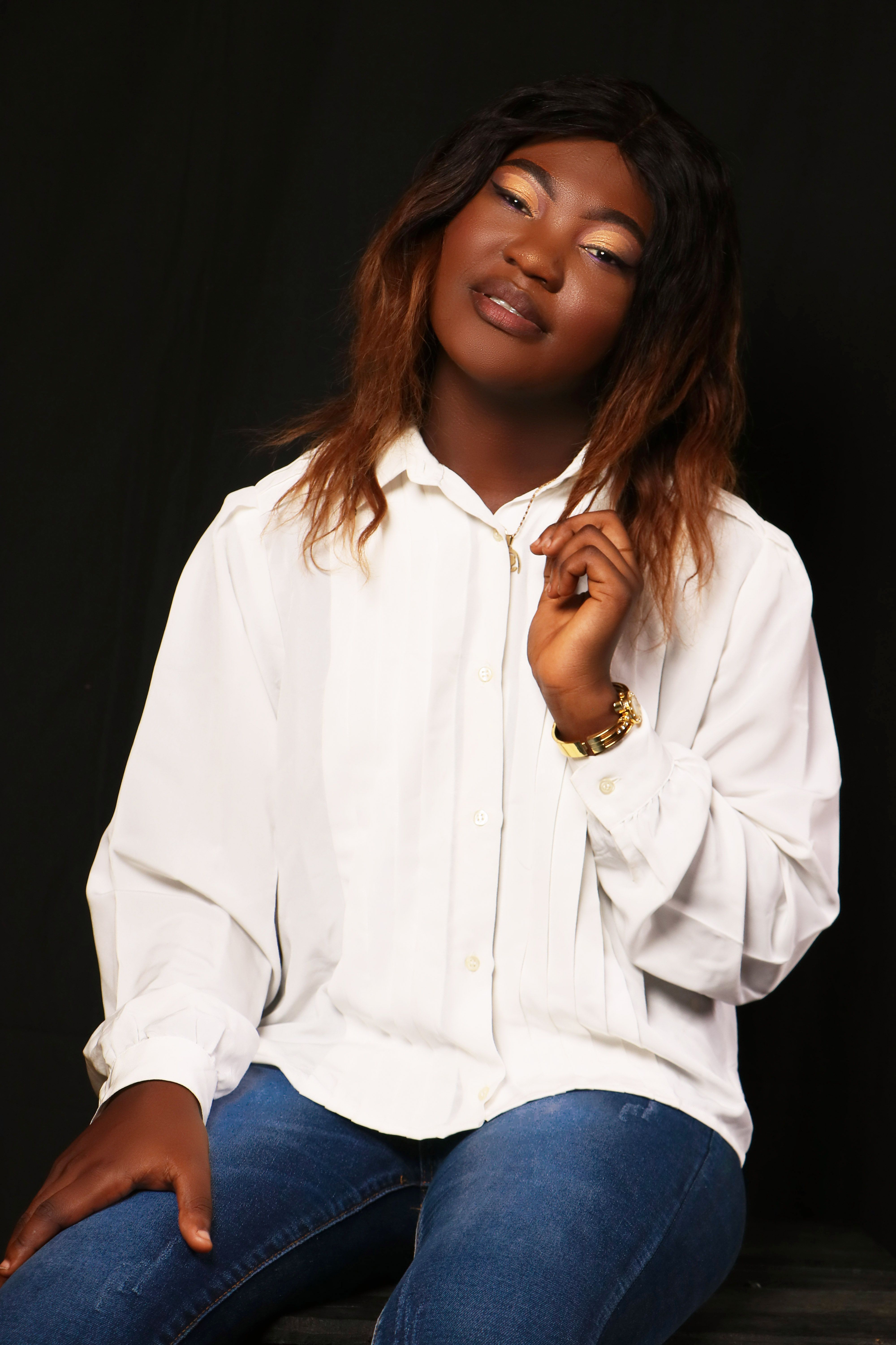 A Woman in White Shirt and Denim Jeans Sitting on Floor · Free Stock Photo