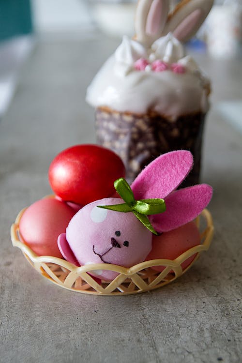 Bunny Head Toy and Colored Eggs on a Plastic Tray