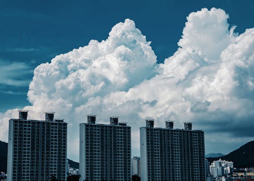 High Rise Buildings in the City under the Cloudy Sky
