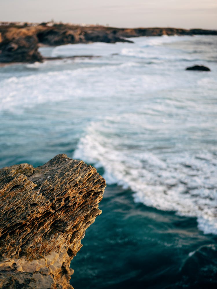 Foam On Waves Hitting Sea Shore