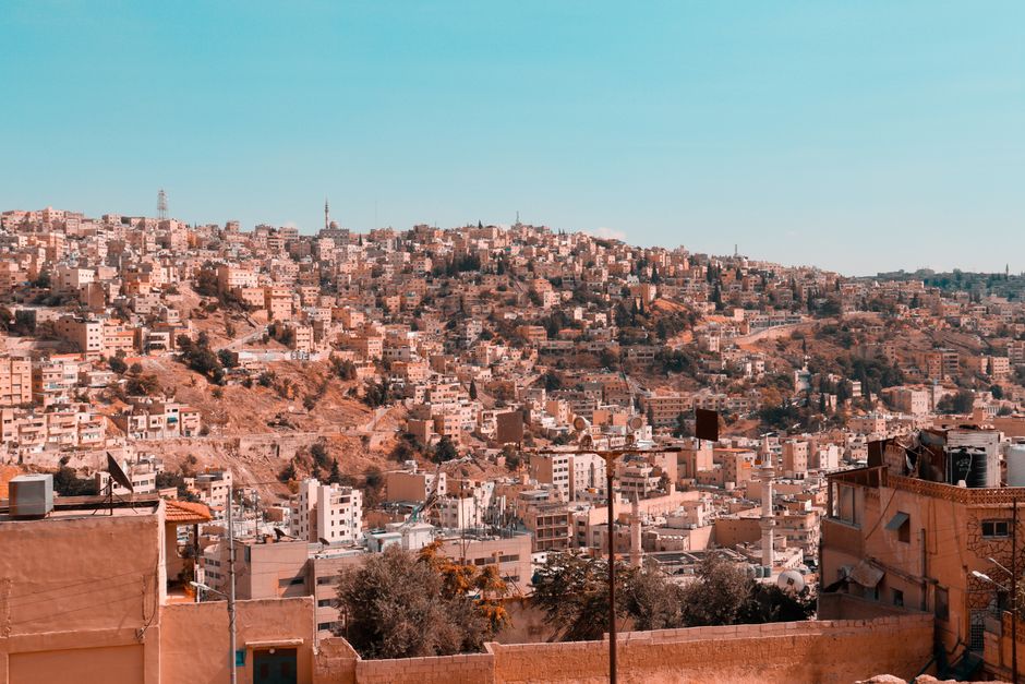 Busy street scene in Amman, Jordan, with people and luggage, illustrating potential for lost items.