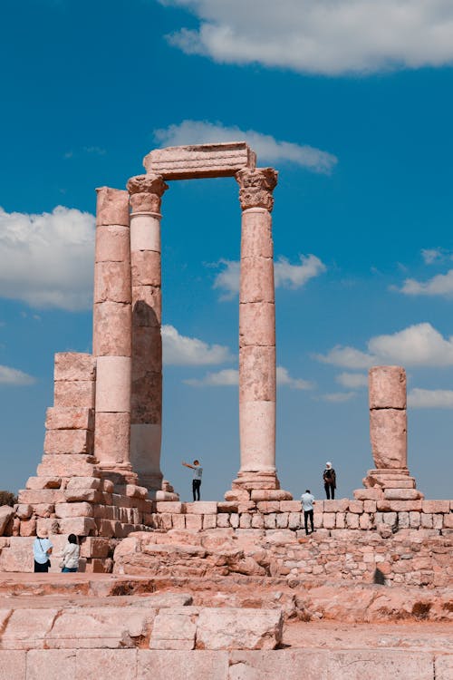 People Standing on Amman Citadel National Historical Site Under Blue Sky