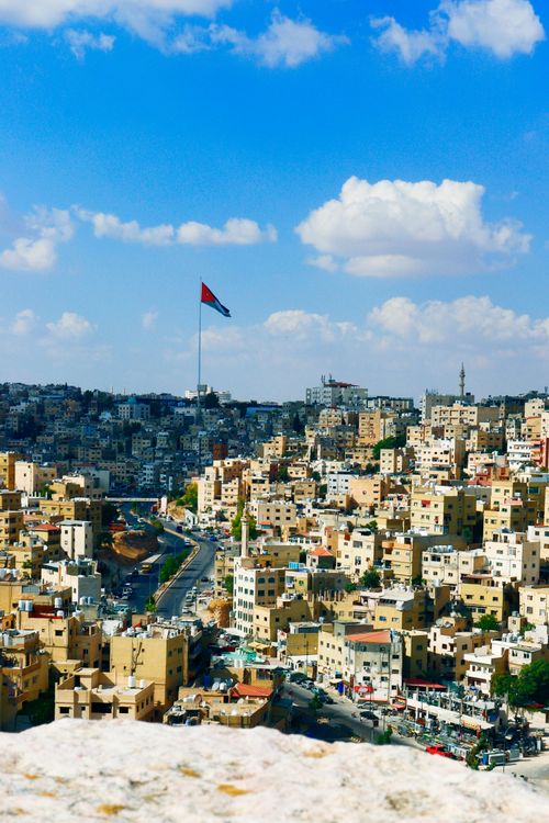 Free Scenic view of Amman cityscape with Raghadan Flagpole under a bright blue sky. Stock Photo
