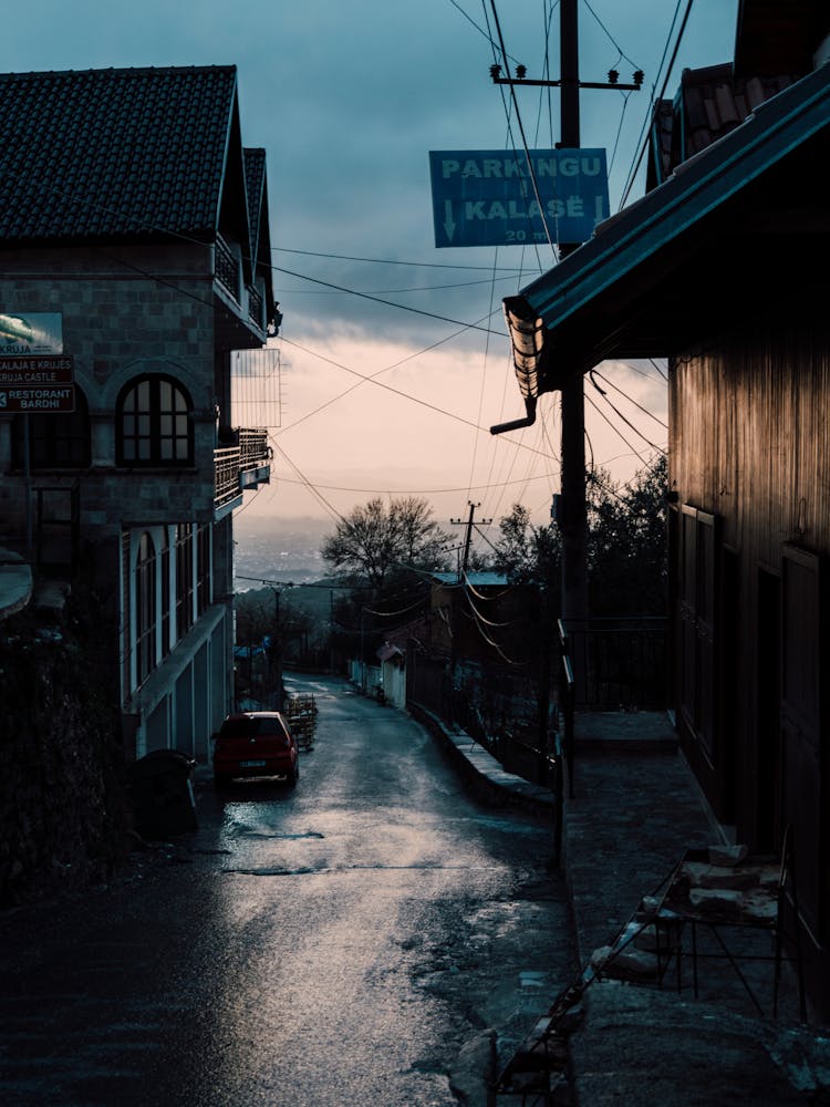 Wet Road In The Mountains Near Houses