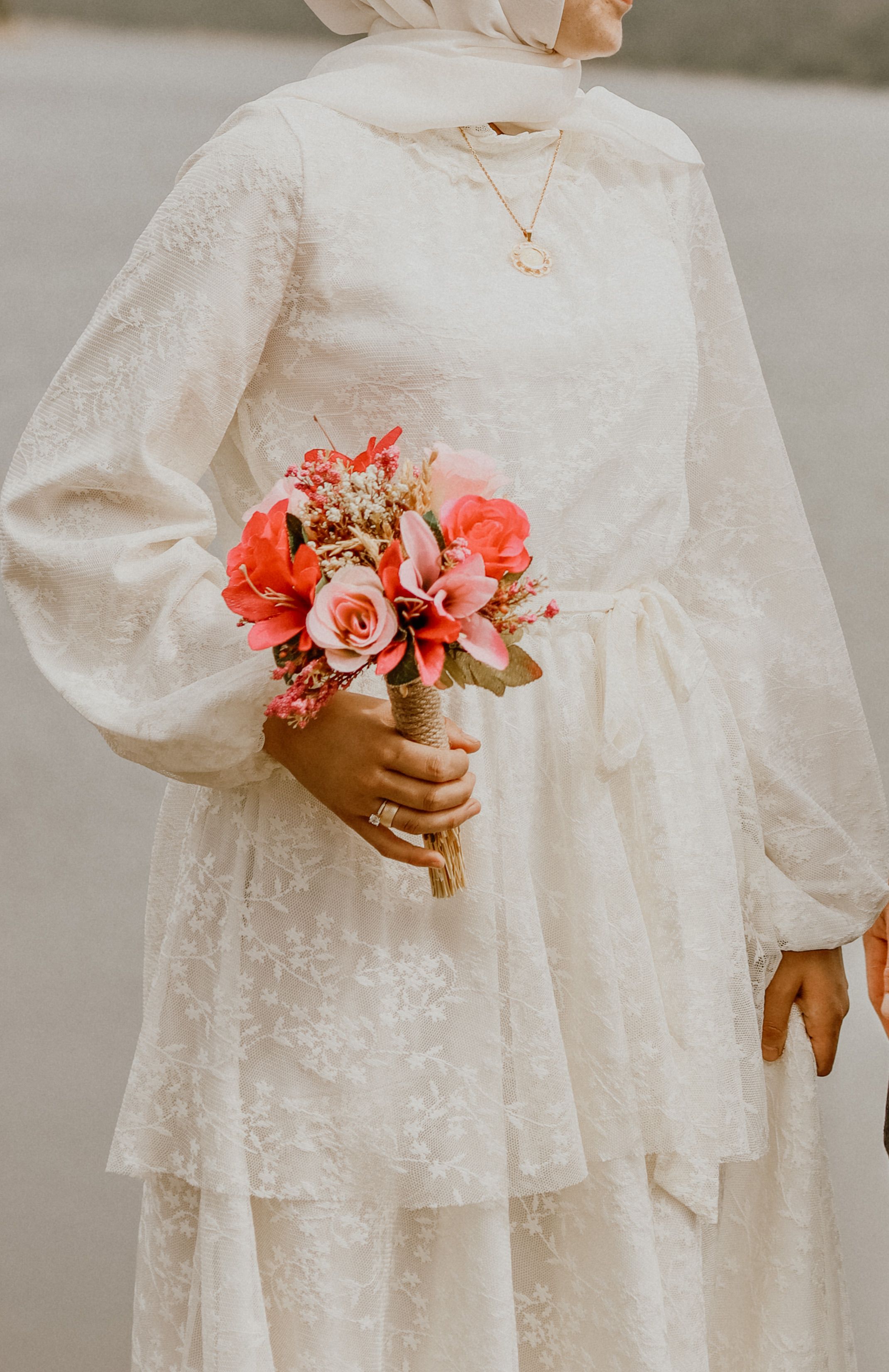 Woman in a White Long Sleeve Dress Holding a Bouquet of Flowers · Free ...