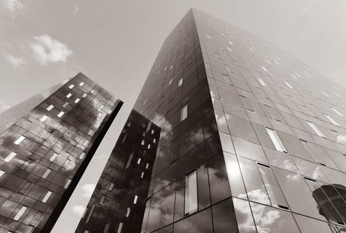 Free Monochrome view of sleek glass skyscrapers in Zagreb reflecting clouds. Modern architectural design. Stock Photo