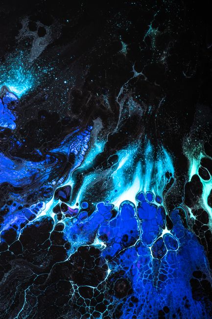 Dynamic abstract painting with flowing blue and black patterns resembling cosmic energy