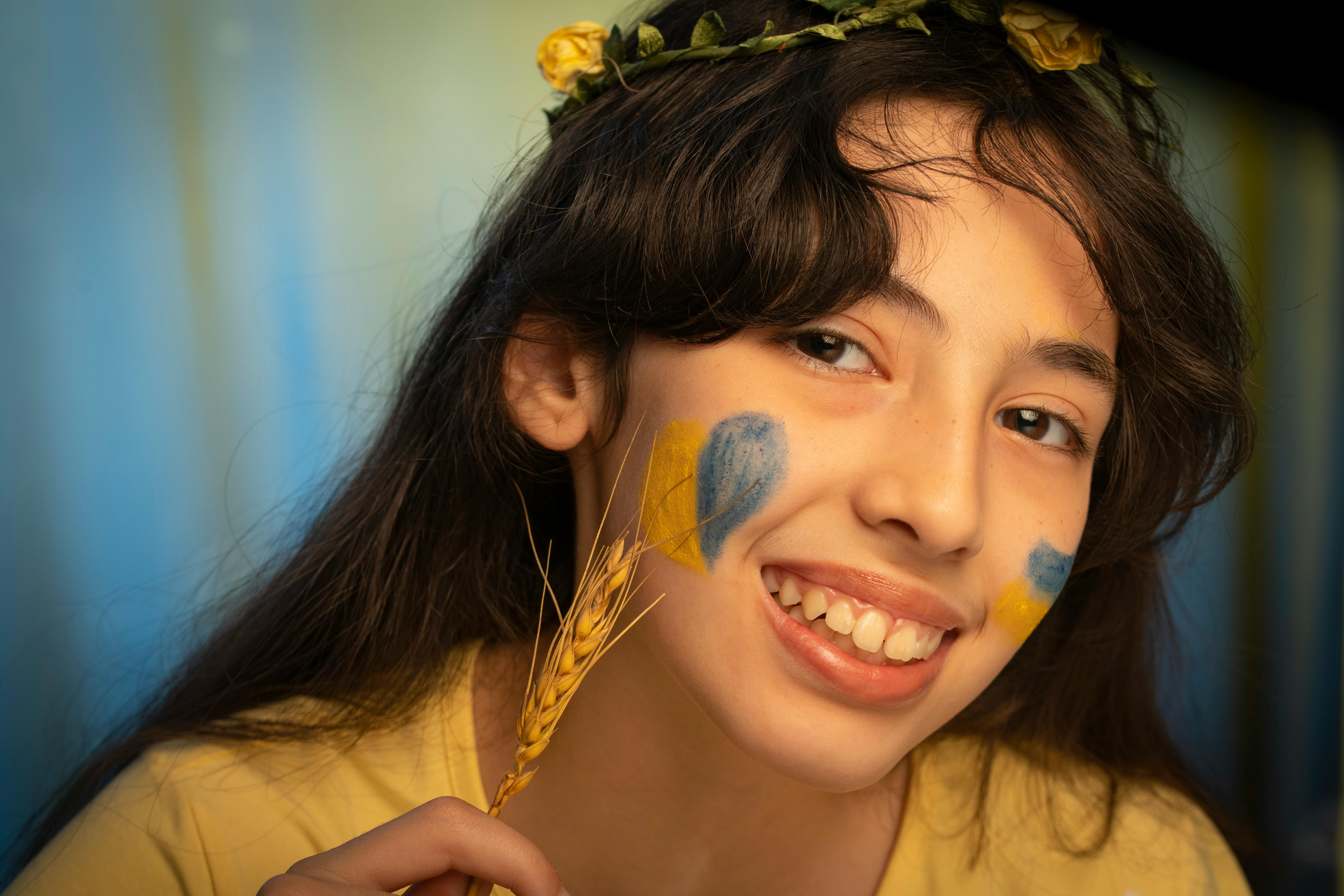 Smiling Girl with Flag Painting on Face · Free Stock Photo