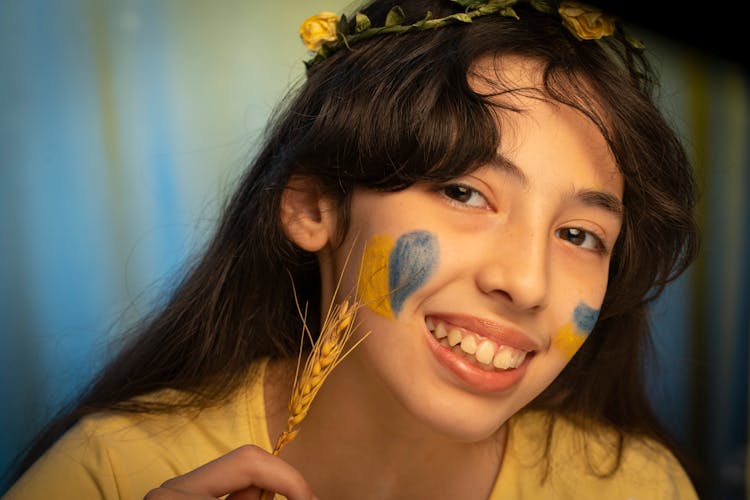 Smiling Girl With Flag Painting On Face