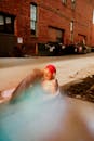 Woman in Red Swimming Cap in Pool