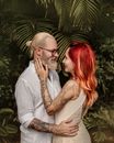 Man and Woman with Dyed Hair Standing Face to Face and Hugging 