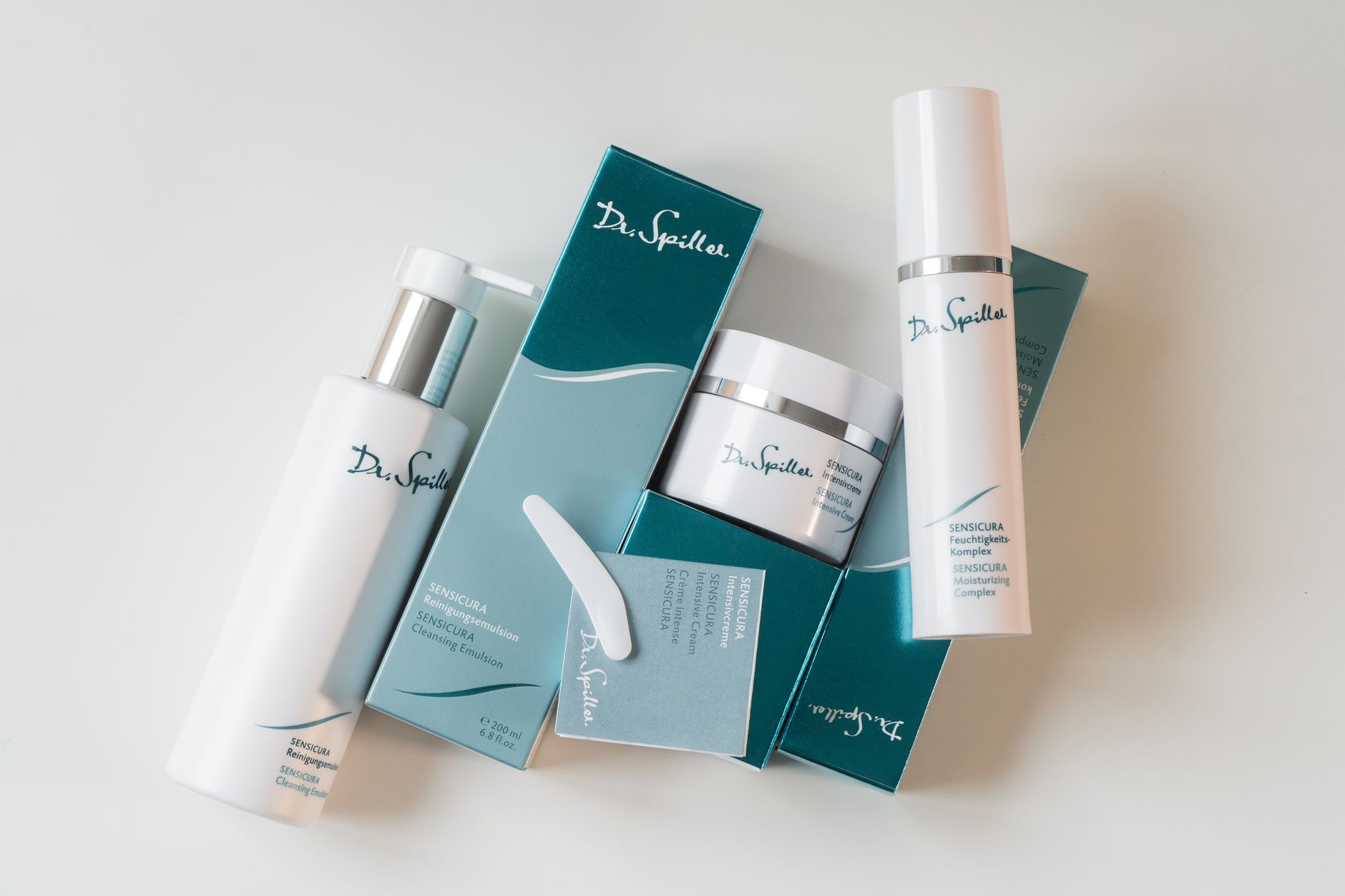 Elegant display of modern skincare products on a white background. Ideal for beauty and wellness promotions.