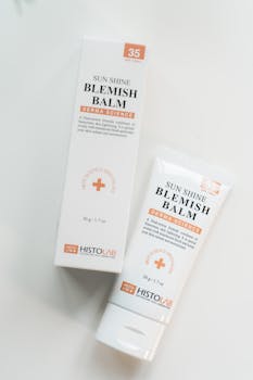 Minimalist flatlay of HISTOLAB Sun Shine Blemish Balm packaging on a white surface.