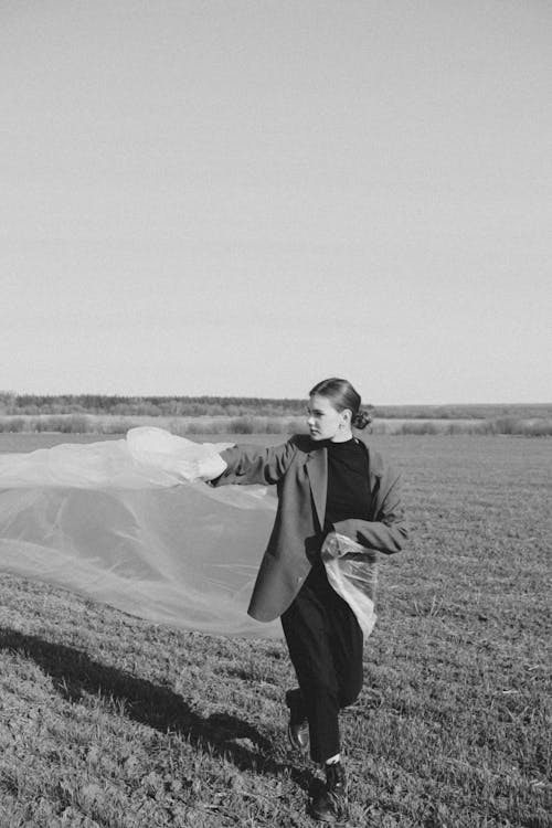 A Woman Holding a Piece of Fabric