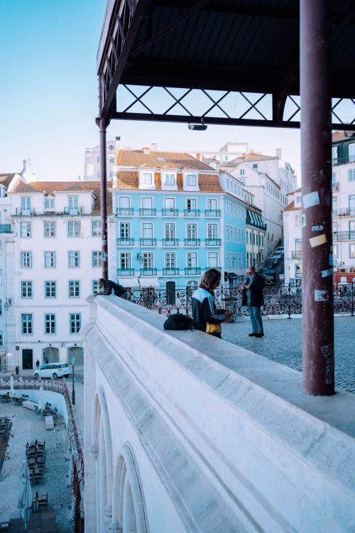 Free Charming view from a Lisbon rooftop showcasing historic architecture and urban life. Stock Photo