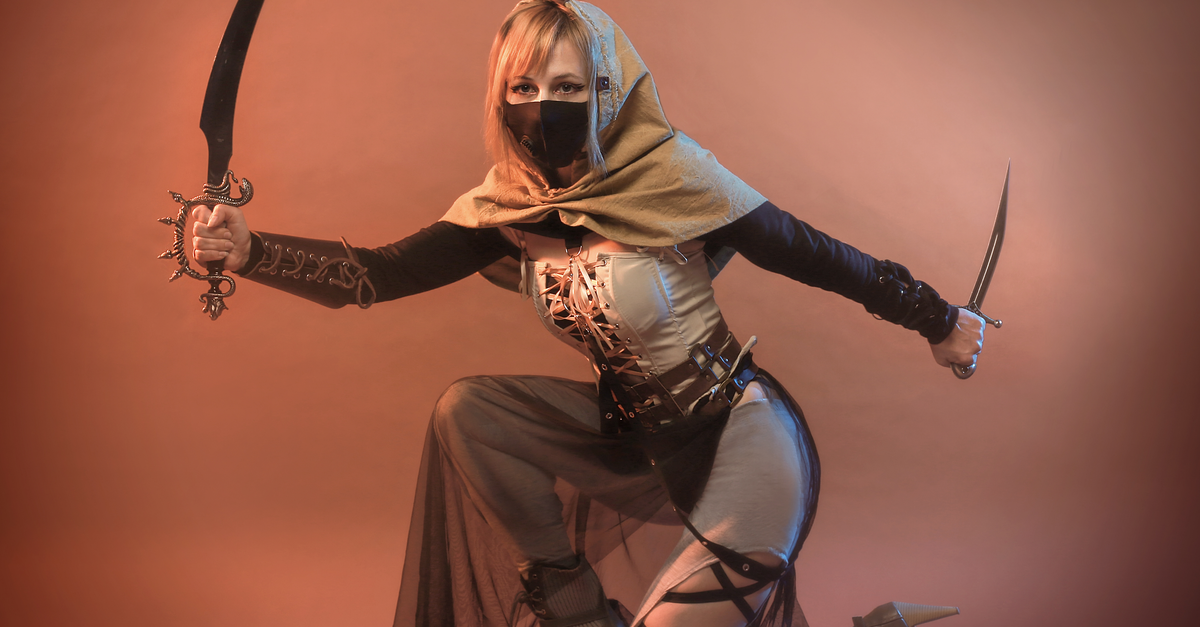 Kneeling Assassin Wearing Face Mask · Free Stock Photo